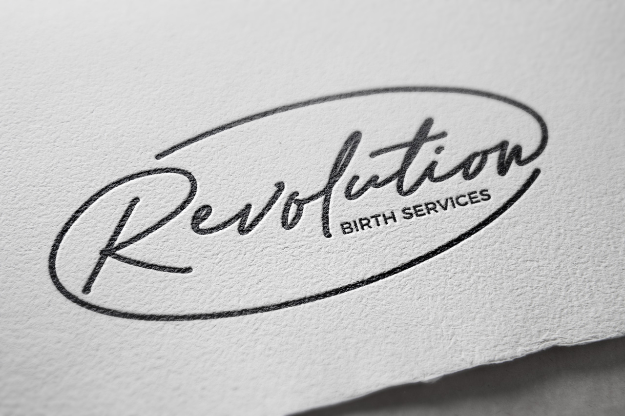 Revolution Birth Services logo mockup relief printed on textured paper by Sarah DaSilva